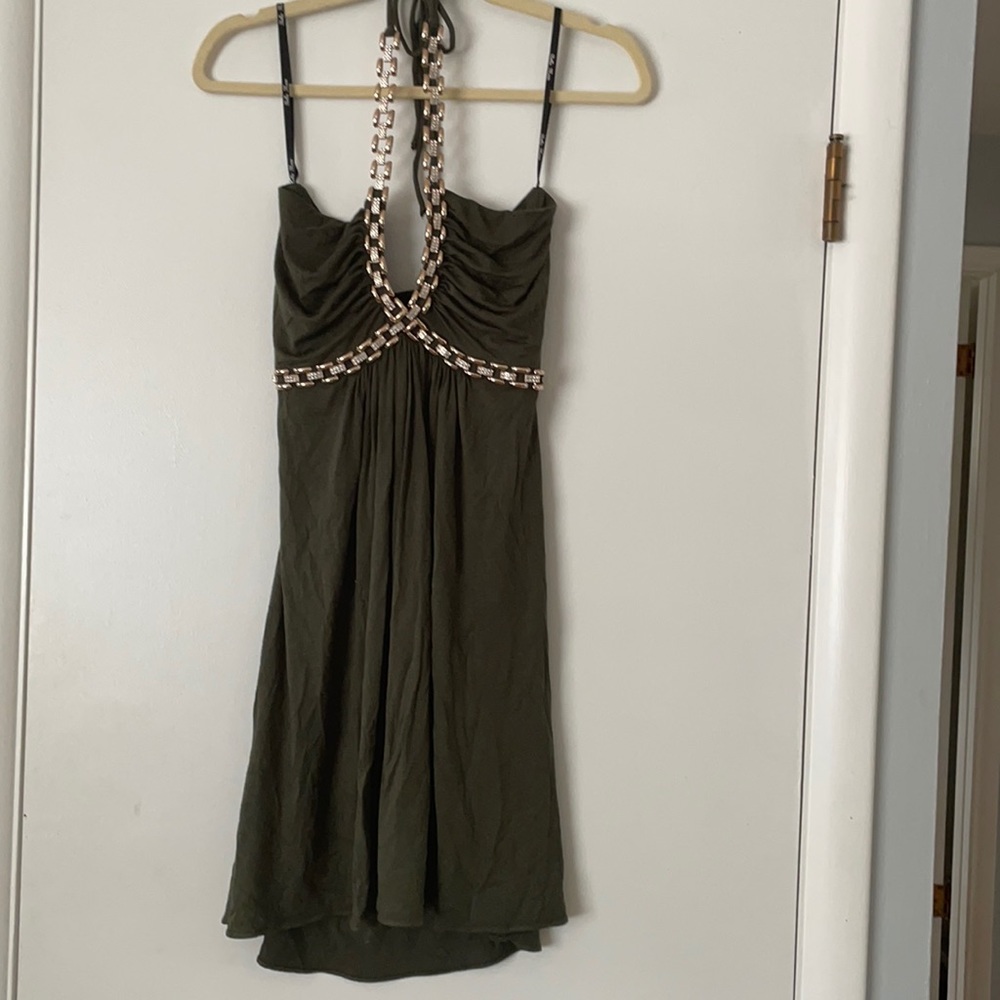 Green dress with decorative chain